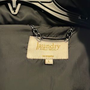 Large, black, feathered, long coat